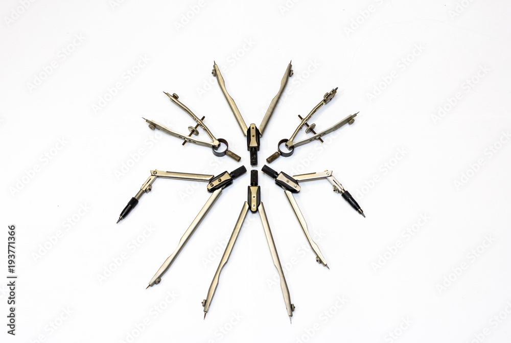Fancy circle formed by the items intended for drawing curved shapes - compasses Fancy circle formed by the items intended for drawing curved shapes - compasses