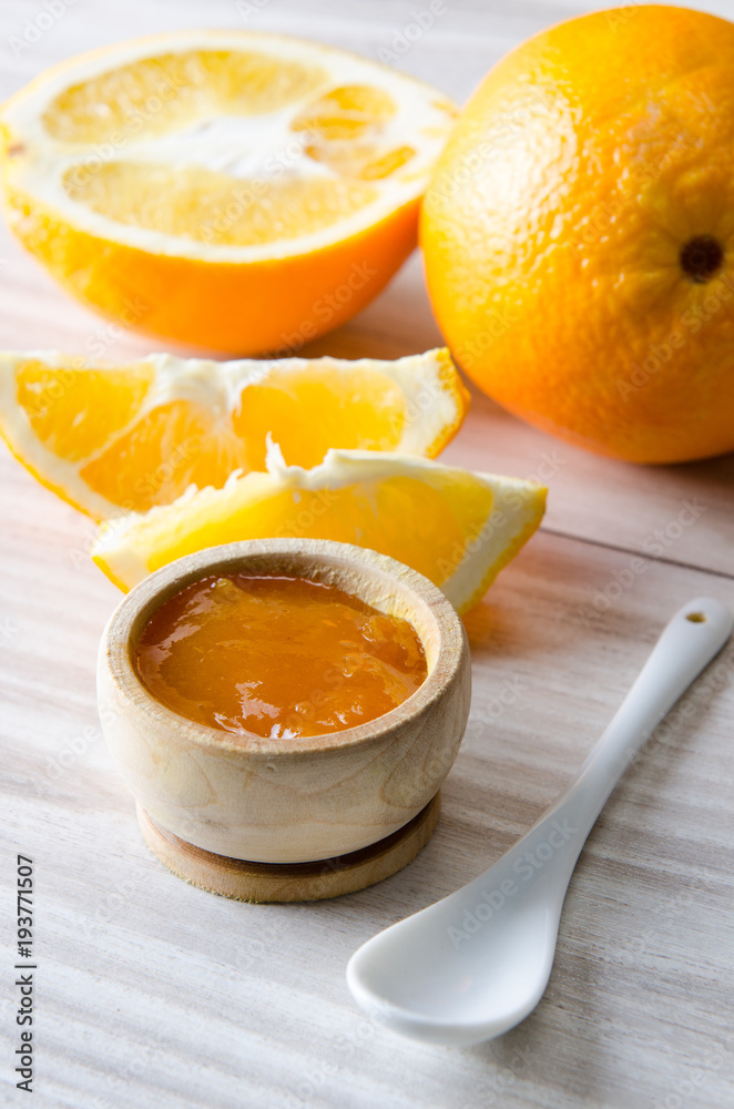 Orange jam served in spoon on the table Orange jam served in spoon on the table