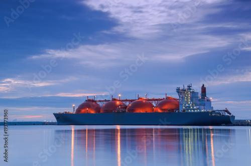 Wallpaper Mural LNG TANKER AT THE GAS TERMINAL - Sunrise over the ship and port
