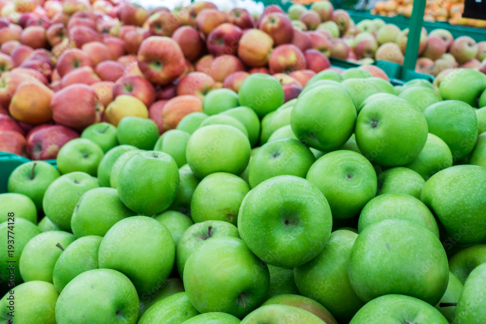 Red and green apples at the farmers market. red and green apples on the market