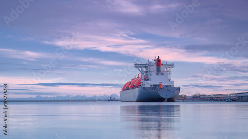 LNG TANKER AT THE GAS TERMINAL - Sunrise over the ship and port