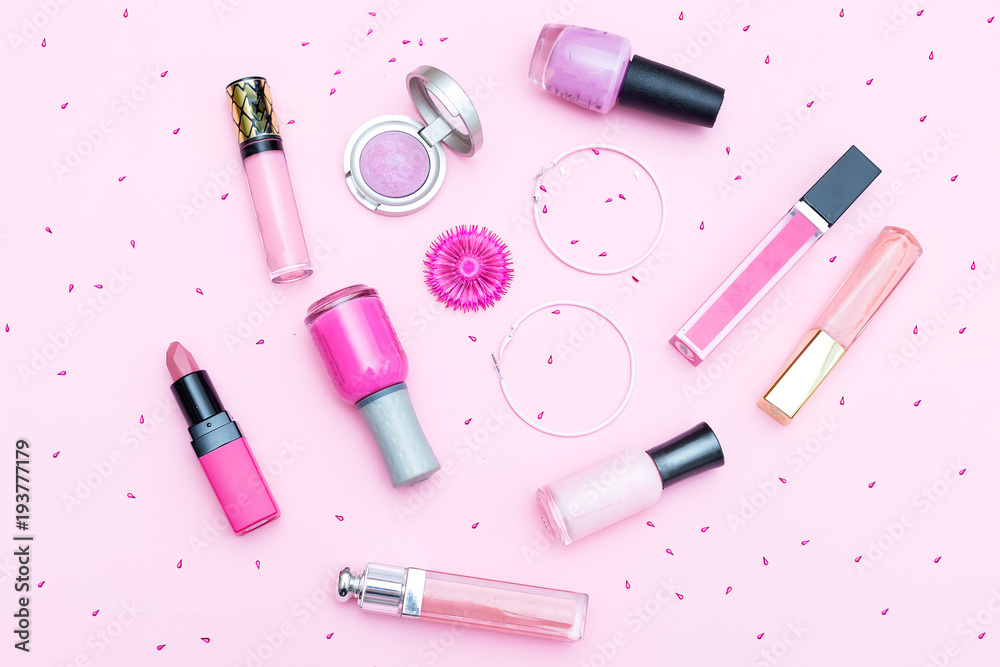 Pink make-up cosmetics on a pink background. Flat lay Pink make-up cosmetics on a pink background. Flat lay