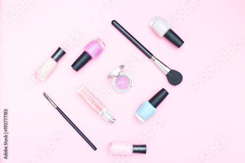 Female beauty makeup on pink background. Flat lay