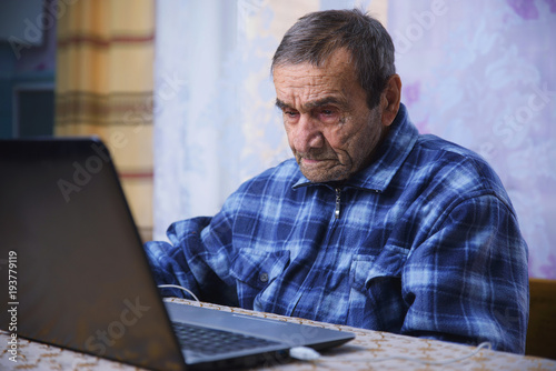 elderly people learn modern gadgets, computer and smartphone © Антон Фрунзе