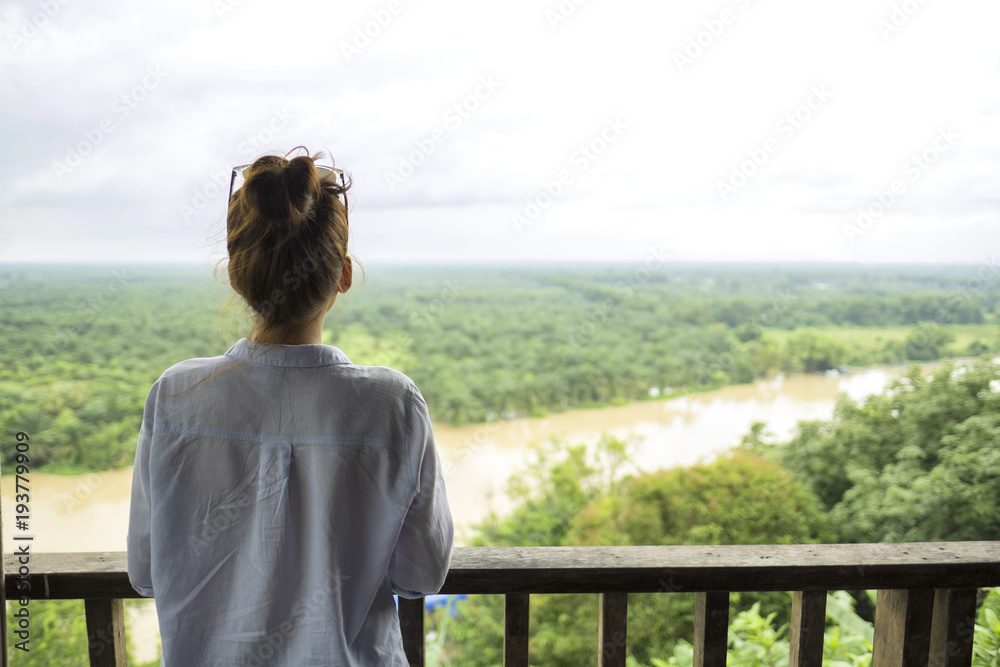 Fototapeta premium lonely girl stand alone looking at outdoor nature