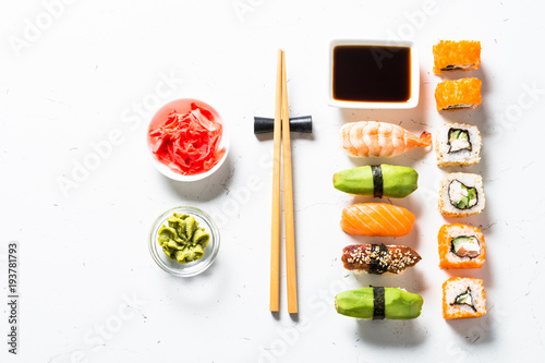 Sushi and sushi roll set on white background.