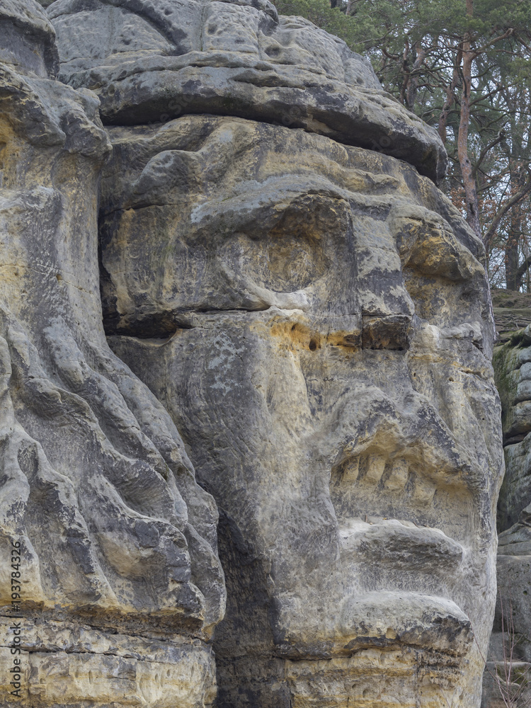 big face devils head sculpted in 19th century by Vaclav Levy to the sand stone rock in Zelizy, czech republic