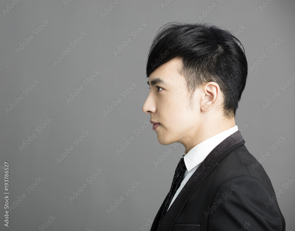 Side view of serious young businessman Side view of serious young businessman