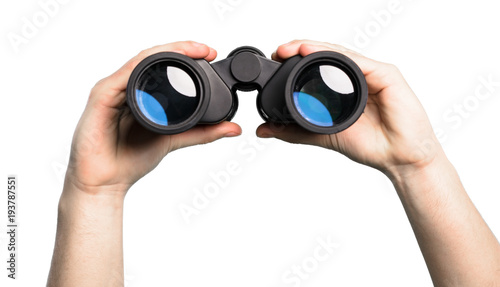 Hand holding Binoculars over isolated white background