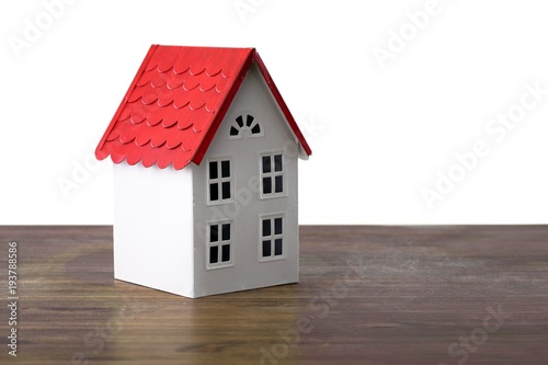 House over isolated white background on table