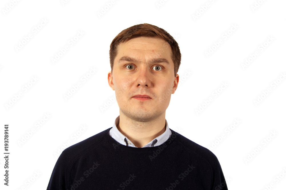 Portrait of a calm young man dressed in a black sweater and a light jacket Portrait of a calm young man dressed in a black sweater and a light jacket