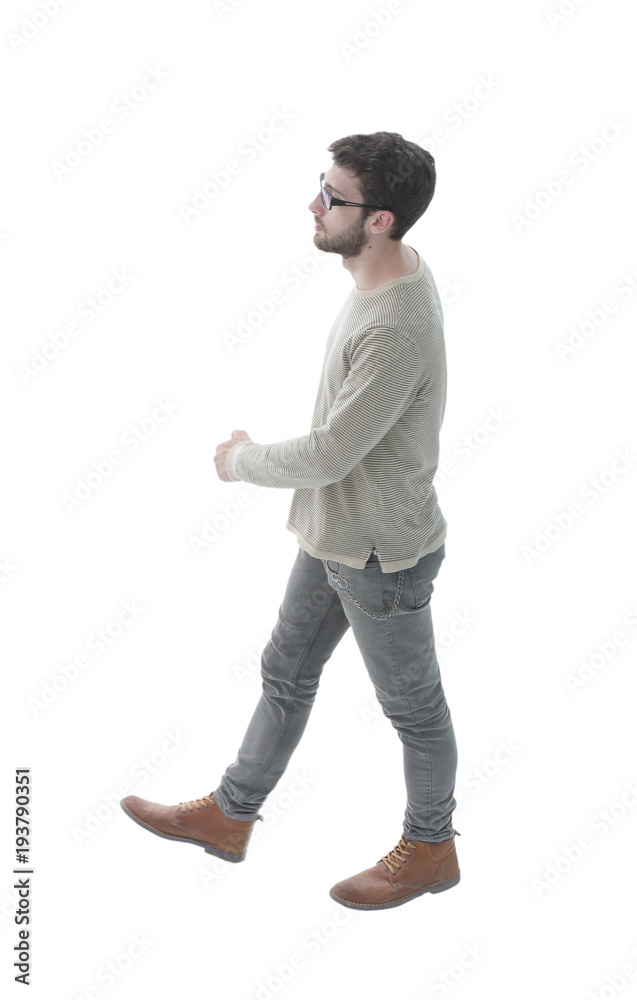 Fototapeta premium side view. modern young man confidently goes forward.