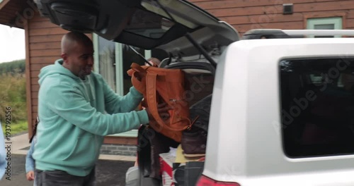 Family Unpacking the Car