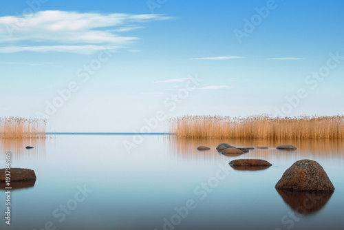 blue sky is reflected Ladoga lake in the evening photo