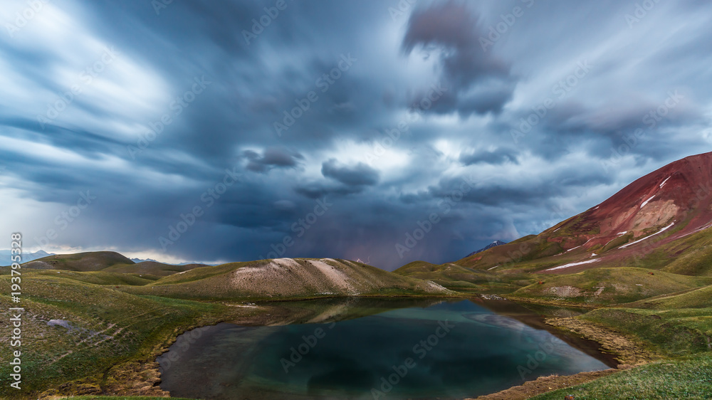 View of Tulpar Kul lake in Kyrgyzstan during the storm