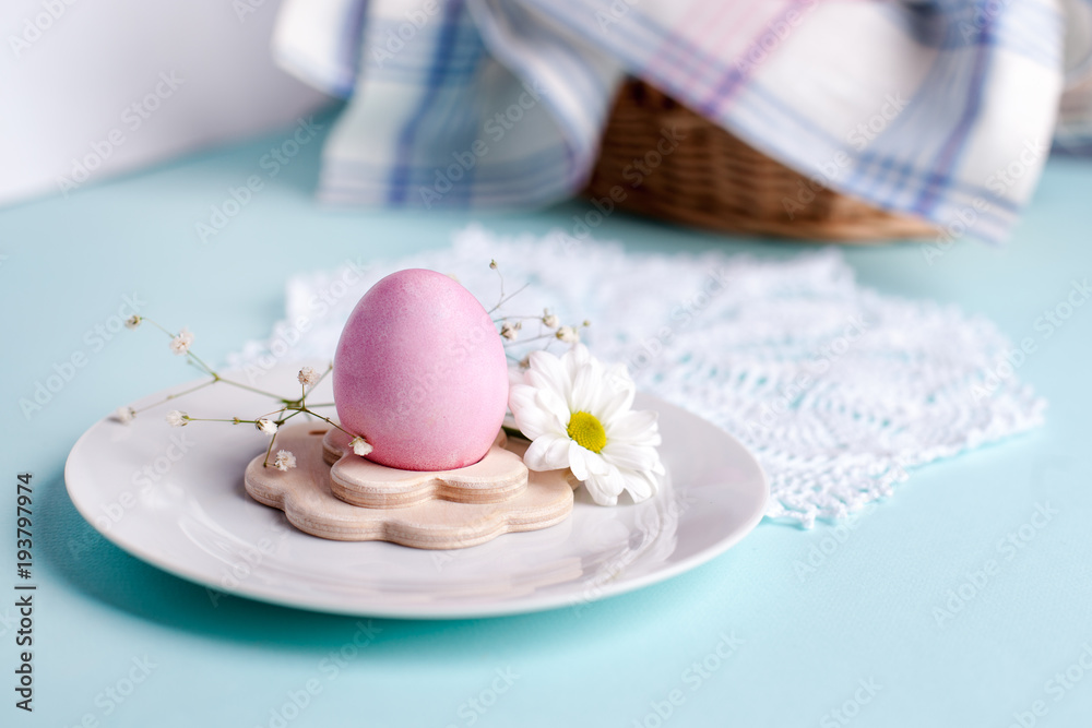 an egg in a stand with floral elements - elements of the Easter festive table, an option for serving an egg in a stand with floral elements - elements of the Easter festive table, an option for serving
