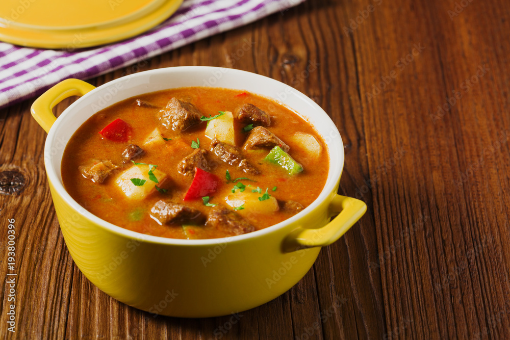 Beef stew served with cooked potatoes. Beef stew served with cooked potatoes.