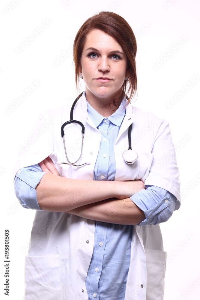 A nurse in front of a white background A nurse in front of a white background