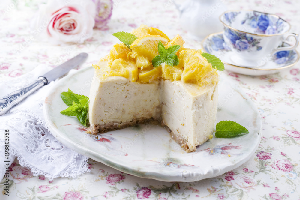 Traditional lemon cheesecake as close-up on a plate