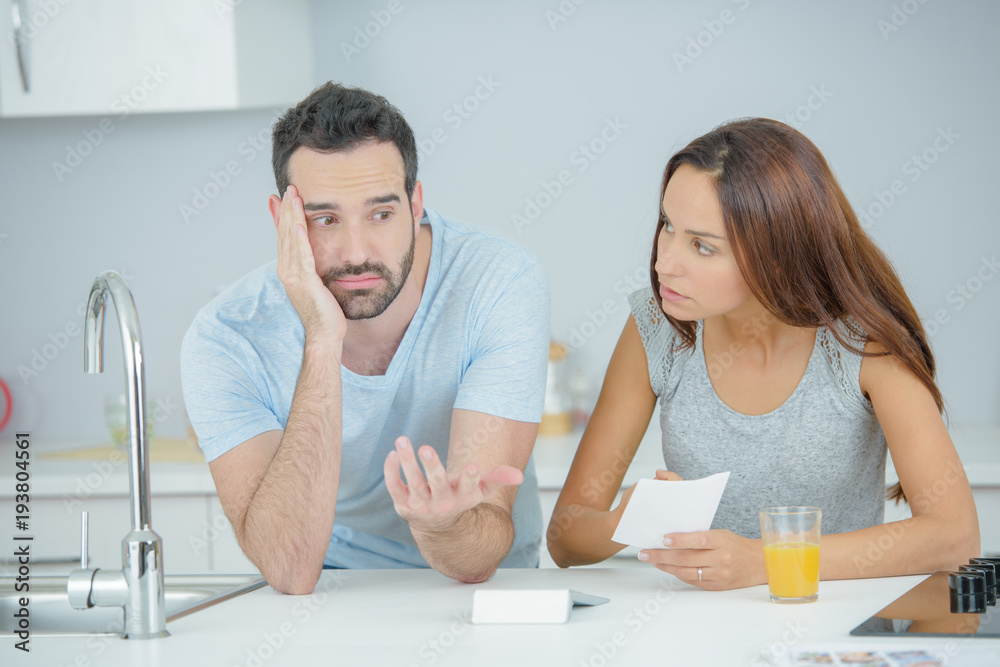 Fototapeta premium Couple arguing in the kitchen