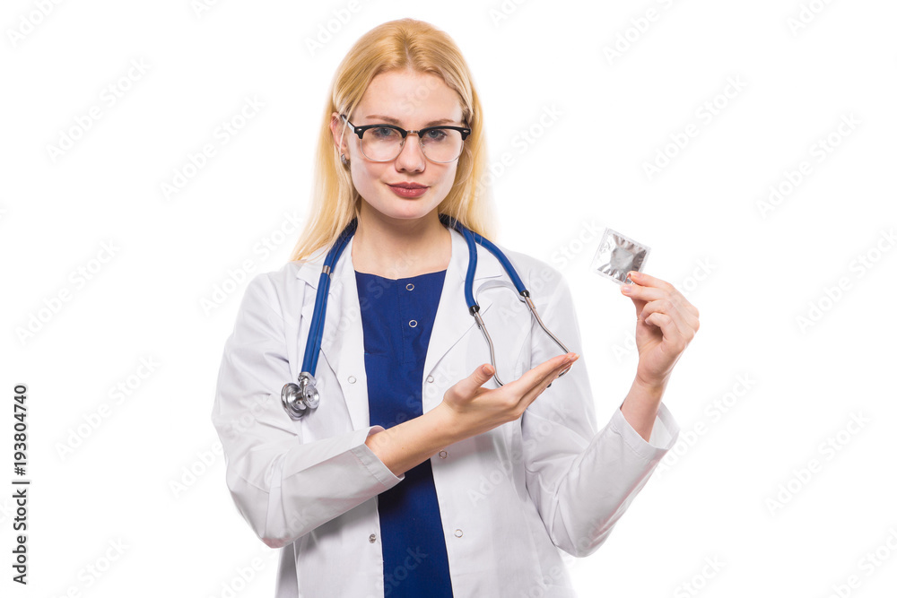 Woman doctor with stethoscope hold condom Woman doctor with stethoscope hold condom