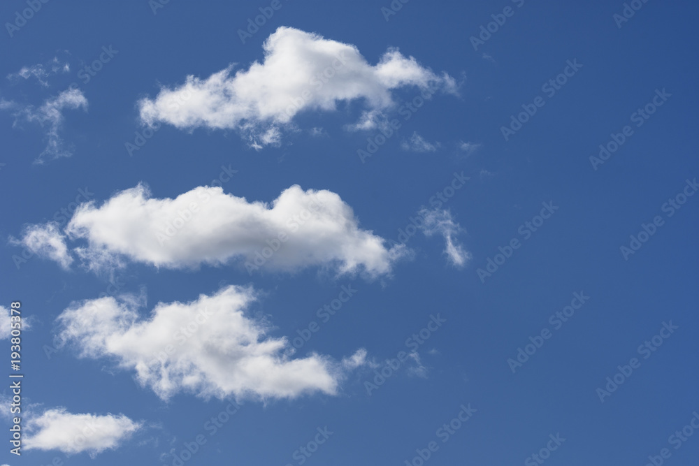 Obraz premium White clouds in the blue sky