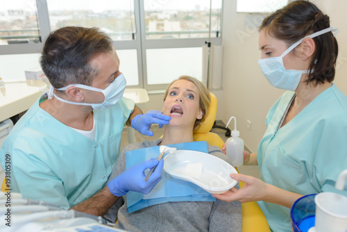 portrait of terrified woman scared at dentist