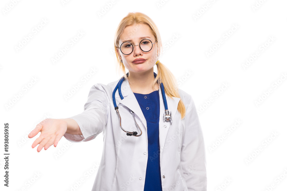 Woman doctor in white coat shows her palm