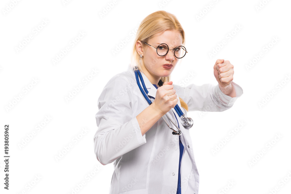 Woman doctor in white coat shows her fists Woman doctor in white coat shows her fists