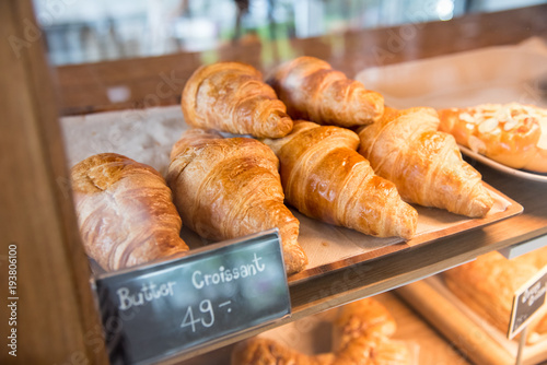 Bakery on shelf show for sale, with tag price, Butter croissant