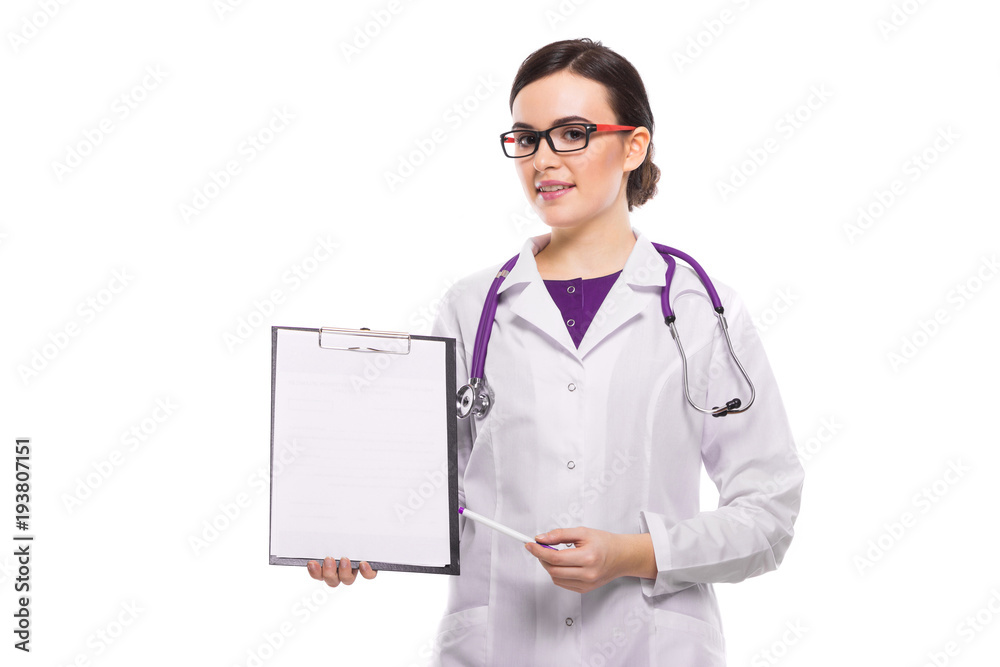 Young woman doctor with stethoscope holding pen in her hand showing on clipboard in white uniform on white background Young woman doctor with stethoscope holding pen in her hand showing on clipboard in white uniform on white background