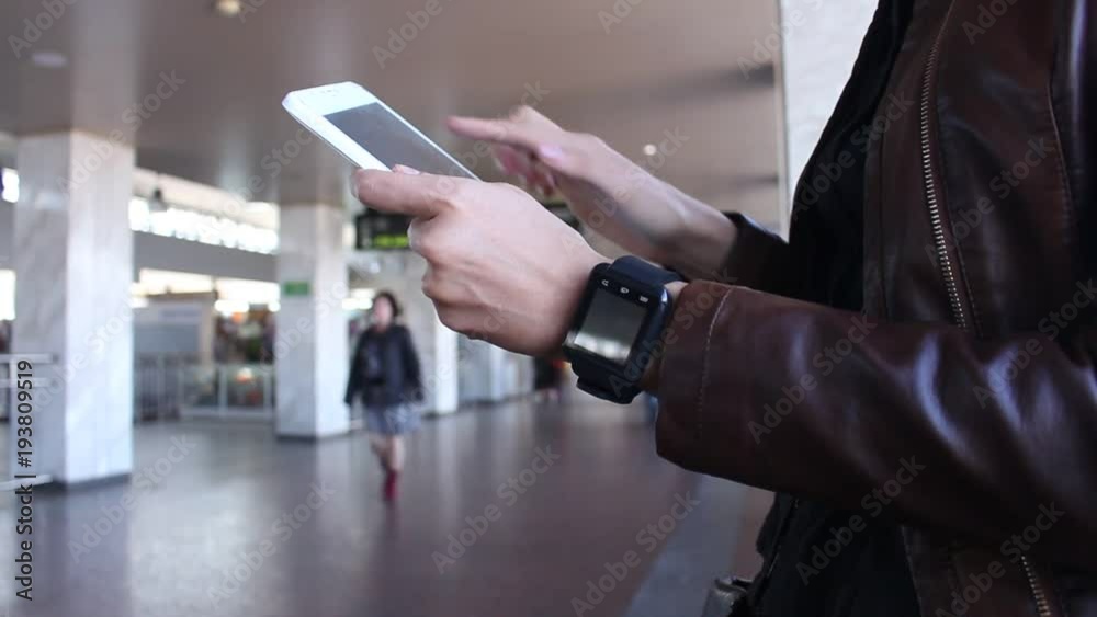 Beautiful girl enjoys a modern tablet on the street. Beautiful girl enjoys a modern tablet on the street.