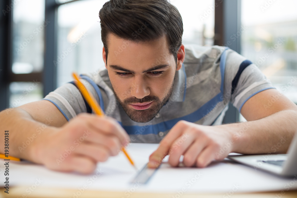 Serious nice man doing a drawing Serious nice man doing a drawing