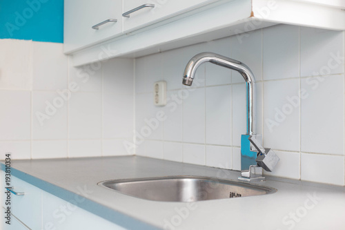 Modern empty new kitchen sink with silver tap