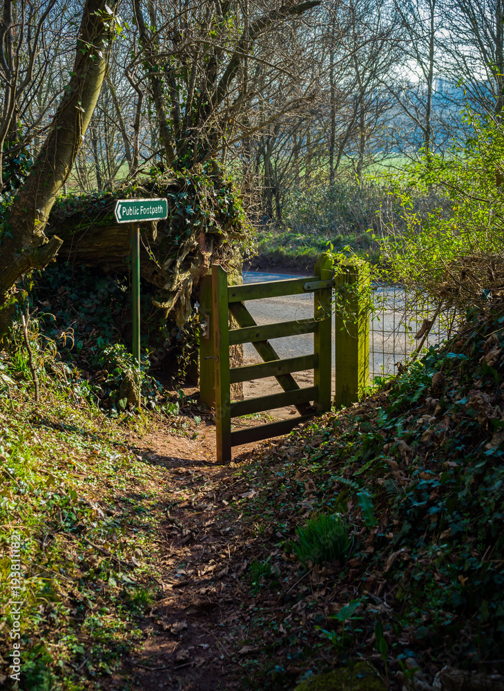 countryside public footpath with open gate in spring countryside public footpath with open gate in spring