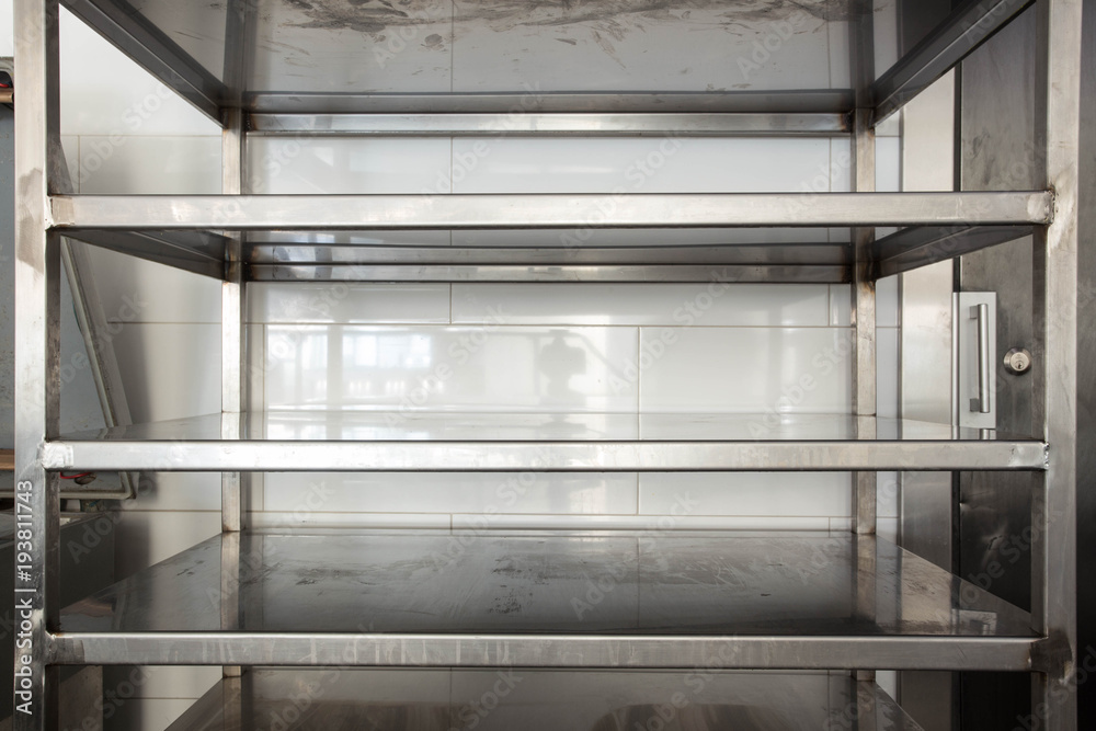 Empty new clean kitchen storage room stainless steel in a hotel or rastaurent Empty new clean kitchen storage room stainless steel in a hotel or rastaurent
