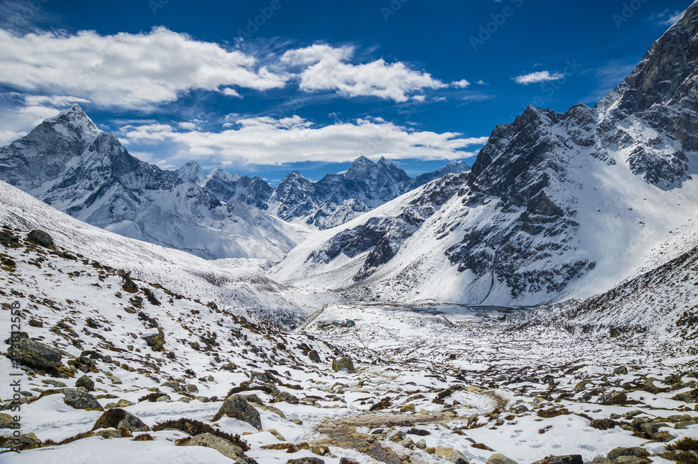 Beautiful view of Ama Dablam and Kanthega peaks, with Dughla village in the distance, in the Hymalayas