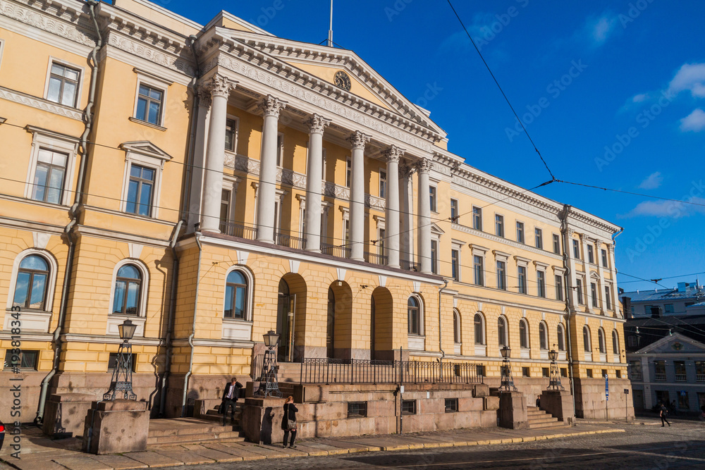 HELSINKI, FINLAND - AUGUST 24, 2016: Yellow colored columned Government Palace on the Senate Square in Helsinki