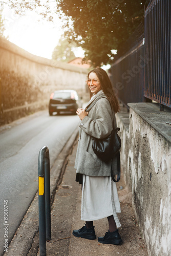 Beautiful young girl on a narrow street. © teksomolika
