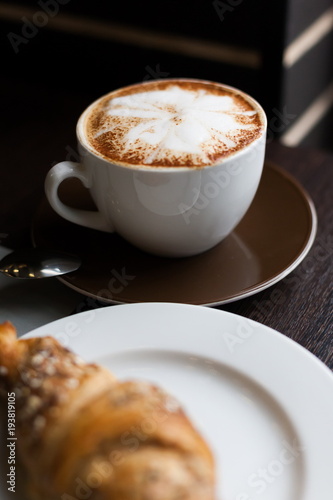 Food. Cappuccino and croissant