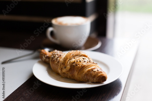 Food. Cappuccino and croissant