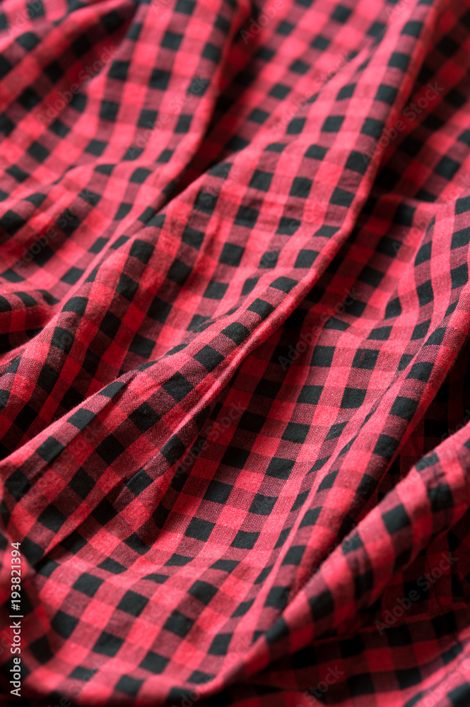 Red and black classic checkered cotton fabric. Plaid texture, male cloth design Red and black classic checkered cotton fabric. Plaid texture, male cloth design