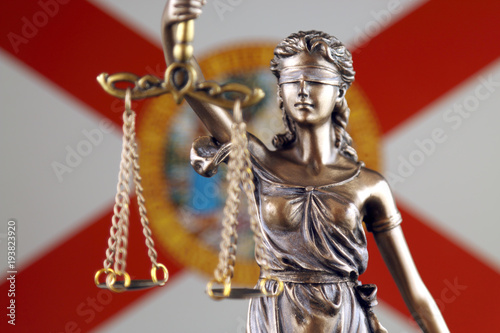 Symbol of law and justice with Florida State Flag. Close up.