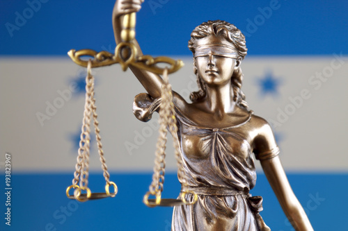 Symbol of law and justice with Honduras Flag. Close up.