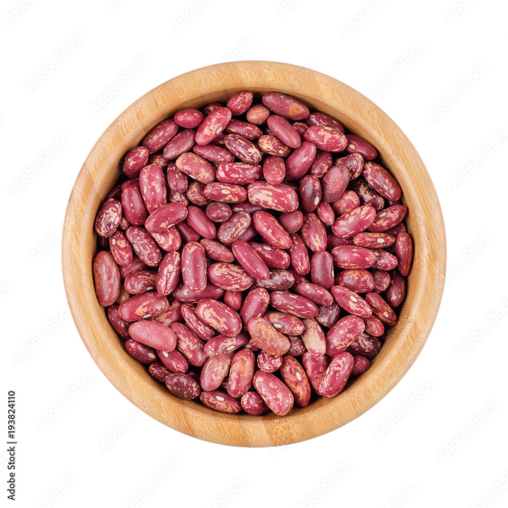 Variegated beans (pinto) in wooden cup. Isolated on white.Top view. Variegated beans (pinto) in wooden cup. Isolated on white.Top view.