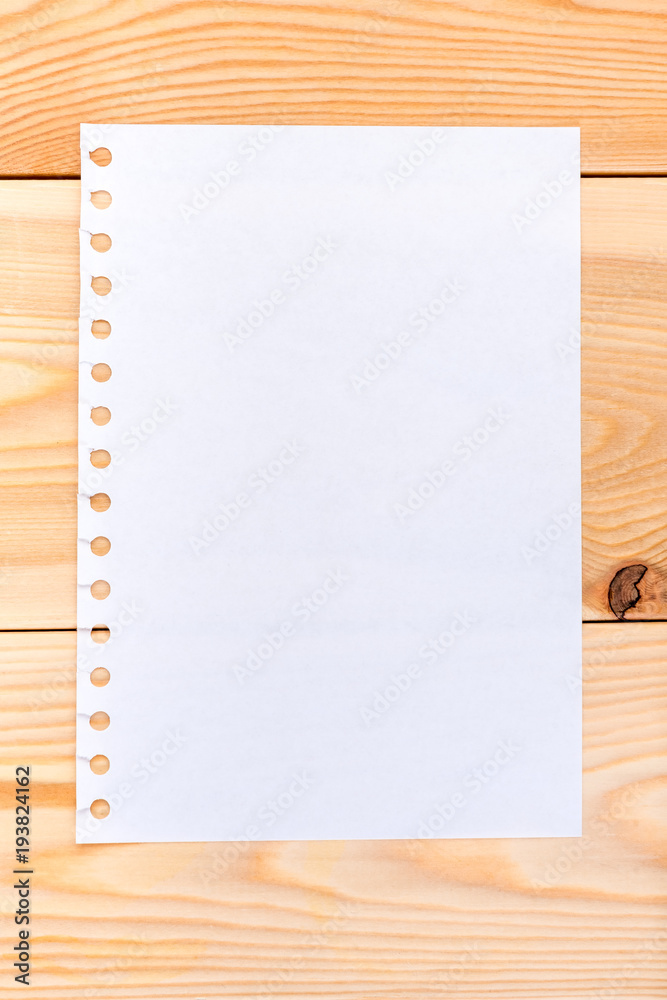 a sheet of paper on wooden boards - blank for writing a sheet of paper on wooden boards - blank for writing