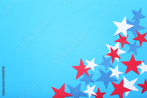 Paper stars on blue background
