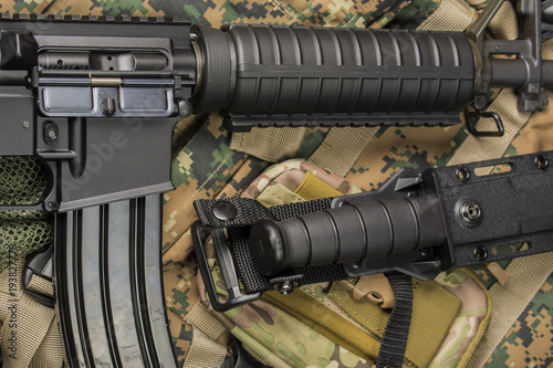 automatic rifle and knife