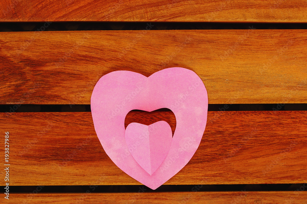 Valentine card with pink heart on floor wood, concept love with copy space Valentine card with pink heart on floor wood, concept love with copy space