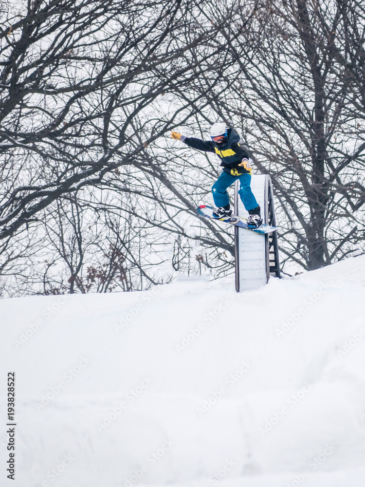 People are having fun in downhill skiing and snowboarding